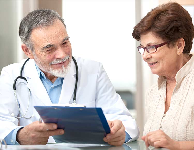Doctor showing patient clipboard